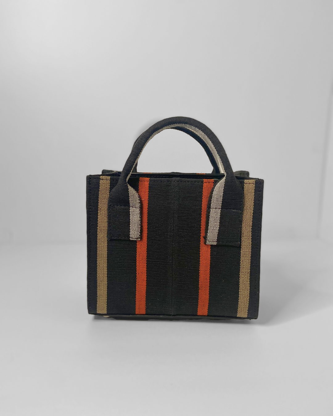 mini tote purse made out of black/orange/gold aso oke fabric and genuine leather.