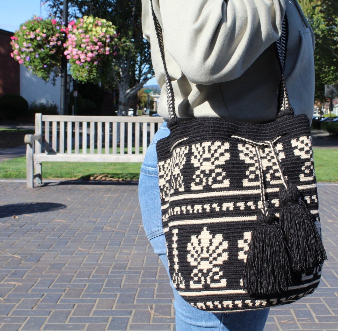 side view of our mochila mediana in black & cream