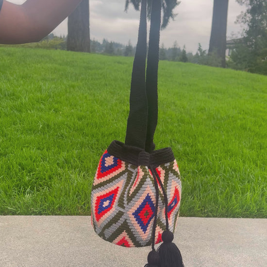 360 degree view of the mini mochila bag in the sunrise colorway.