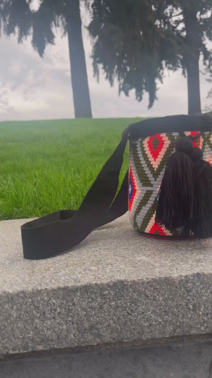 left/right angle pan of the mini mochila bag in the sunrise colorway